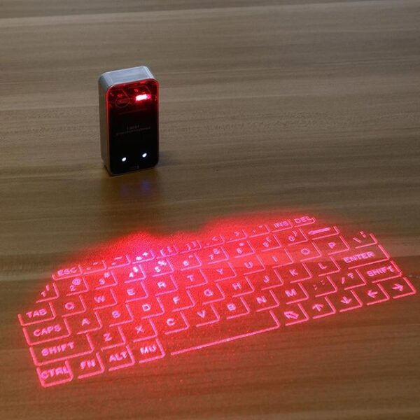 Portable Bluetooth Virtual Laser Keyboard Wireless Projection Mini Touch Keyboard For Computer Phone Laptop With Mouse.jpg 640x640 c20dc13e 898c 42ad 8959 14daf9daff0c - Prenosna virtuelna tastatura/projektor za: telefon, tablet. . Povezuje se preko bluetooth-a  Radi kao  tastatura i kao mis5 nivoa zvuka kucanja4 nivoa podesavanje svetlosti   Radi na ravnoj povrsiniPuni se preko USB kabla-optimalno vreme punjenja oko 120minuta3 sata efektivnog rada        Kompatibilna je sa OS :   Windows XP/VISTA/7/8, Windows Phone 7, IOS4/5/6(iPhone and iPad) Android 3.1   Dimenzije: 7.8cm x 4.1cm x 2cm